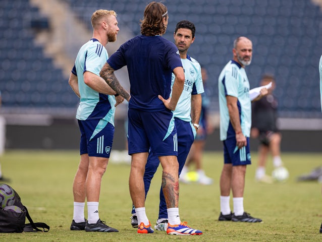 Mikel Arteta chats with new signing Riccardo Calafiori during an open training session on July 28, 2024