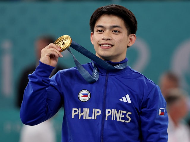 Carlos Edriel Yulo of Philippines celebrates winning gold on August 3, 2024