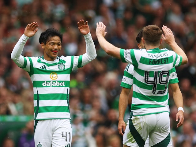 Celtic's Reo Hatate celebrates scoring their first goal with teammates on August 4, 2024