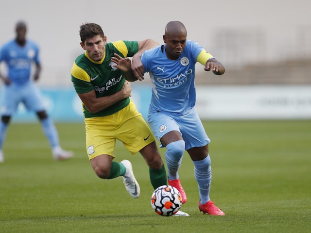 Manchester City's Fernandinho in action with Preston North End's Ched Evans on July 27, 2021