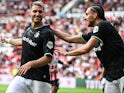 Santiago Gimenez of Feyenoord and Ramiz Zerrouki of Feyenoord celebrate the 1-1 during the 28th edition of the Johan Cruijff Scale between PSV Eindhoven and Feyenoord at the Phillips stadium on August 4, 2024 on August 4, 2024