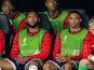 England substitutes Joe Gomez (L) and Liverpool team-mate Trent Alexander-Arnold (R) on the bench during the UEFA Euro 2024 Semi-Final match between Netherlands and England on July 10, 2024