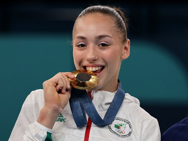 Algeria's Kaylia Nemour celebrates winning gold on August 4, 2024