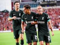 Liverpool midfielder Fabio Carvalho scores celebrates a goal against Manchester United with teammate defender Kostas Tsimikas (21) and midfielder Curtis Jones (17) on August 3, 2024