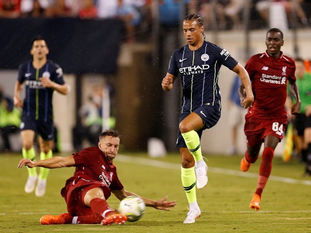 Liverpool's Nathaniel Phillips in action with Manchester City's Leroy Sane on July 25, 2018