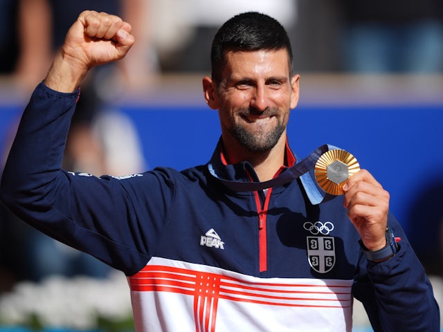 Novak Djokovic (SRB) celebrates after receiving his gold medal during the Paris 2024 Olympic Summer Games at Stade Roland Garros on August 4, 2024