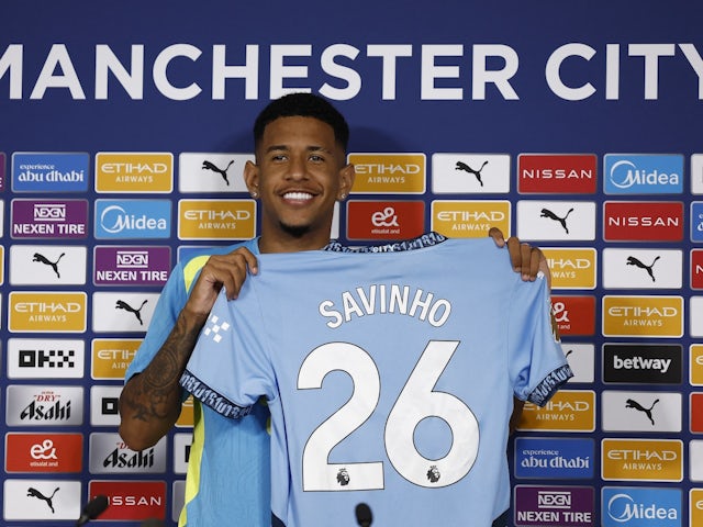 Manchester City new signing Savinho poses with the club shirt after a press conference on August 4, 2024