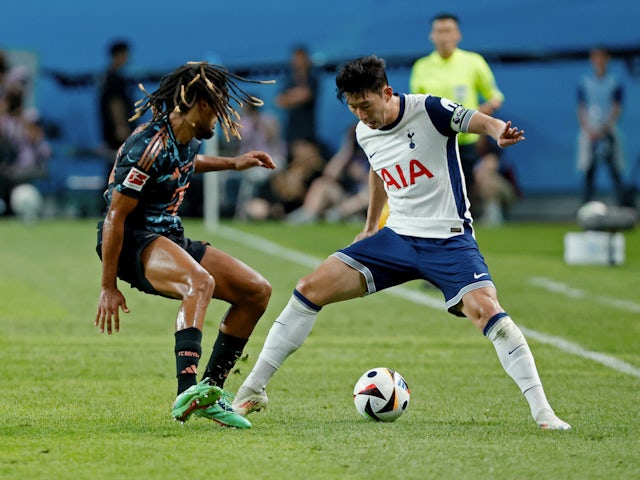 Tottenham Hotspur's Son Heung-min in action with Bayern Munich's Sacha Boey on August 3, 2024