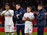 Destiny Udogie and Oliver Skipp of Spurs applaud their team s travelling fans after the final whistle on July 28, 2024