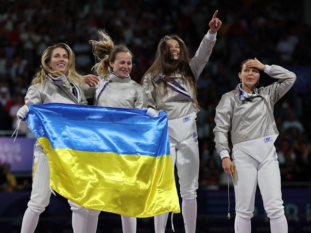 Olga Kharlan of Ukraine, Alina Komashchuk of Ukraine, Olena Kravatska of Ukraine, Yuliia Bakastova of Ukraine celebrate after winning the Gold medal on August 3, 2024