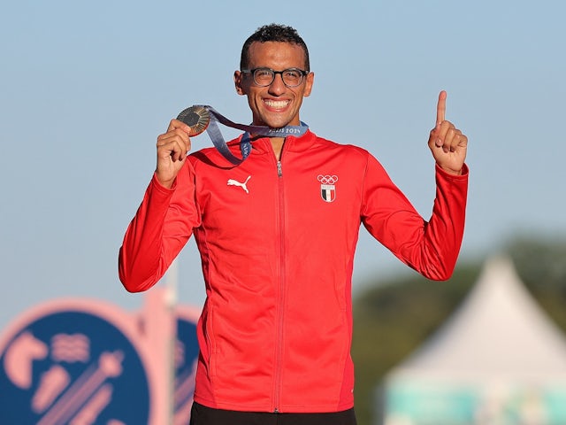 Gold medallist Ahmed Elgendy of Egypt poses with his medal on the podium on August 10, 2024