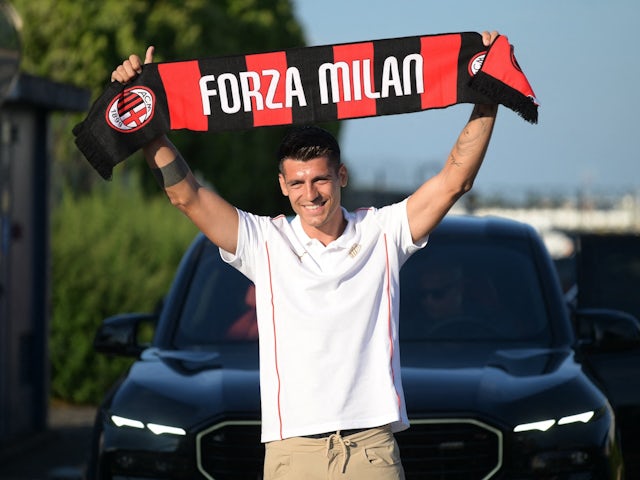 Alvaro Morata poses with scarf as he arrives in Milan to join AC Milan on August 8, 2024