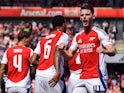 Arsenal midfielder Declan Rice celebrates Arsenal defender William Saliba's goal on August 11, 2024