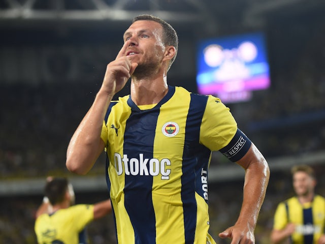 Fenerbahce's Edin Dzeko celebrates scoring in a Champions League second qualifying round match against Lugano July 30, 2024