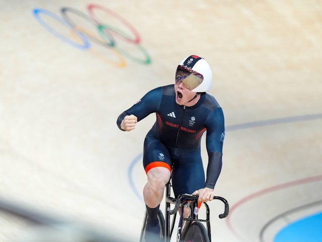 Team GB's Jack Carlin celebrates after track cycling team sprint qualifying on August 4, 2024