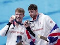 Bronze medallists Jack Laugher of Britain and Anthony Harding of Britain pose with their country flag and medals on August 2, 2024