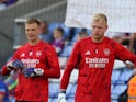 Arsenal goalkeepers Karl Hein and Aaron Ramsdale warm up ahead of the match on August 21, 2023