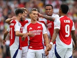 Arsenal's Leandro Trossard celebrates with teammates after scoring their second goal on August 7, 2024