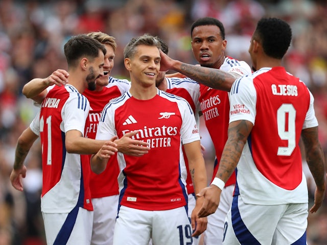 Arsenal's Leandro Trossard celebrates with teammates after scoring their second goal on August 7, 2024