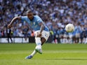 Manchester City's Manuel Akanji scores the winning penalty in the shoot-out to win the FA Community Shield on August 10, 2024