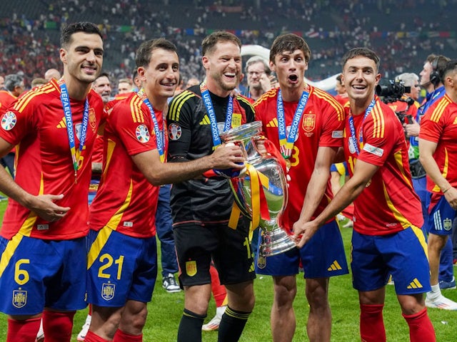 Spain's Mikel Merino, Mikel Oyarzabal, Alex Remiro, Robin Le Normand and Martin Zubimendi celebrate on July 14, 2024