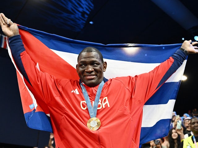 Gold medallist Mijain Lopez Nunez of Cuba celebrates during the ceremony on August 6, 2024