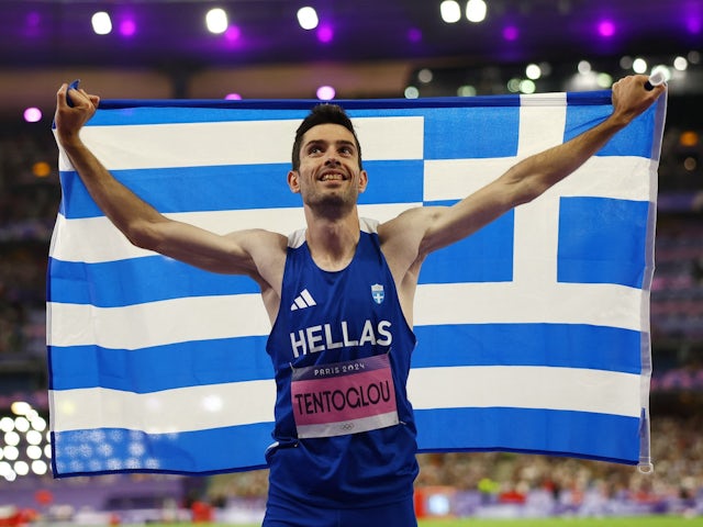 Gold medallist Miltiadis Tentoglou of Greece celebrates after winning on August 6, 2024