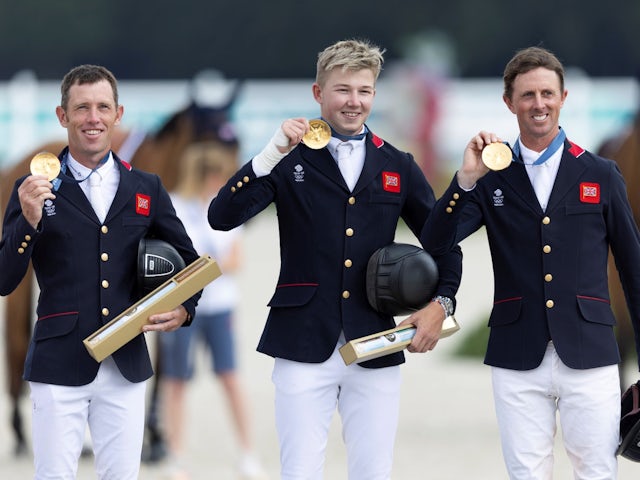 Team GB's Scott Brash, Harry Charles and Ben Maher pictured with their gold medals on August 2, 2024