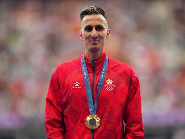 Gold medallist Soufiane El Bakkali of Morocco celebrates on the podium on August 8, 2024