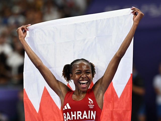 Bahrain's Winfred Yavi celebrates winning gold on August 6, 2024