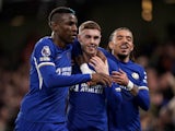 Chelsea's Cole Palmer celebrates scoring their second goal with Nicolas Jackson and Malo Gusto on April 4, 2024