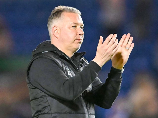 Peterborough United manager Darren Ferguson applauds the fans after the game on May 8, 2024