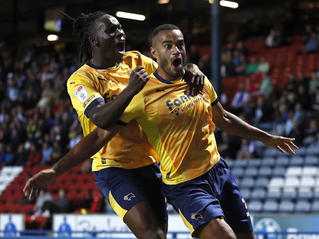 Derby County's Curtis Nelson (right) celebrates scoring their side's first goal of the game with team-mate David Ozoh  on August 9, 2024