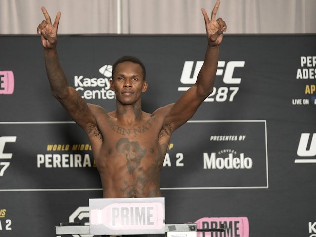 Israel Adesanya steps on the scale for the official weigh-ins on August 8, 2024