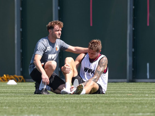 Kristijan Jakic of FC Augsburg with physiotherapist Martin Miller Physiotherapist, on August 14, 2024 [on August 16, 2024]