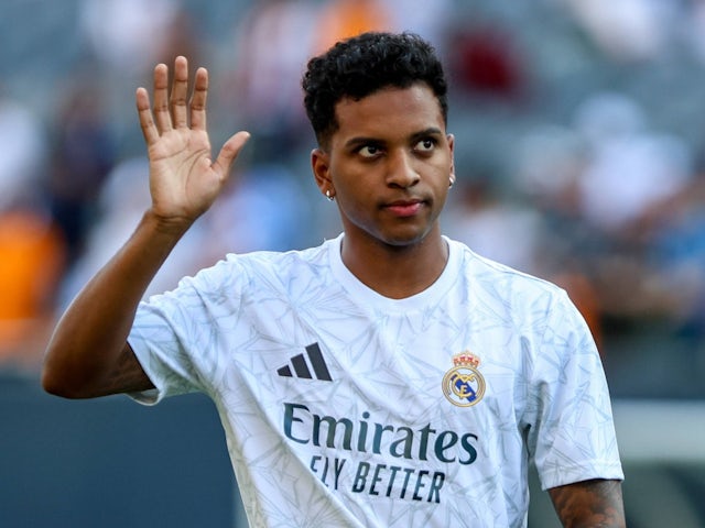 Real Madrid's Rodrygo waves to the fans before the match on July 31, 2024