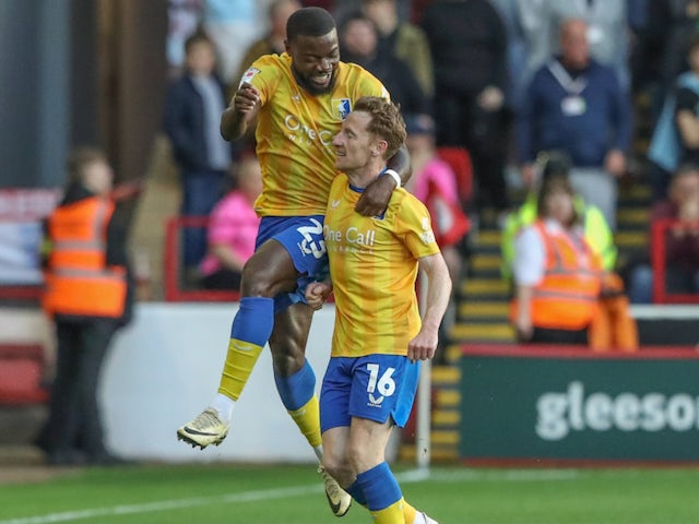 Stephen Quinn celebrates scoring for Mansfield Town on August 9, 2024