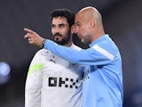 Manchester City's Ilkay Gundogan pictured with manager Pep Guardiola during training on June 9, 2023