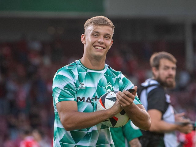 Keke Topp of Werder Bremen cheers after the final whistle with match ball after the match against Energie Cottbus, on August 19, 2024 [on August 22, 2024]