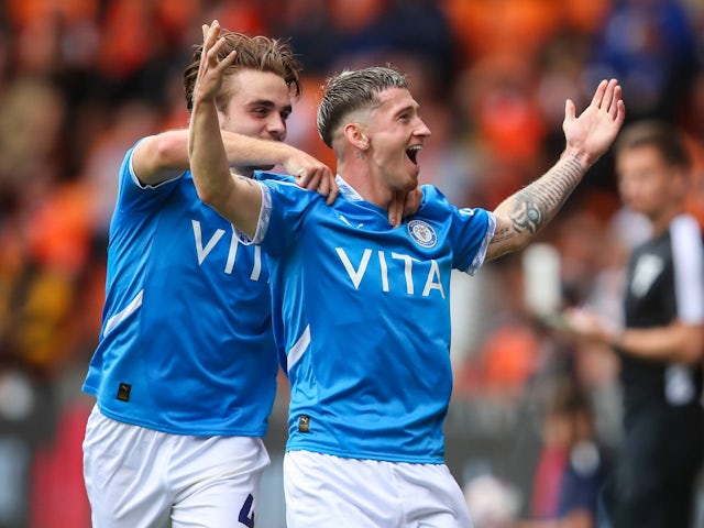 Stockport County's Louie Barry celebrates with Lewis Bate after scoring their first goal on August 17, 2024