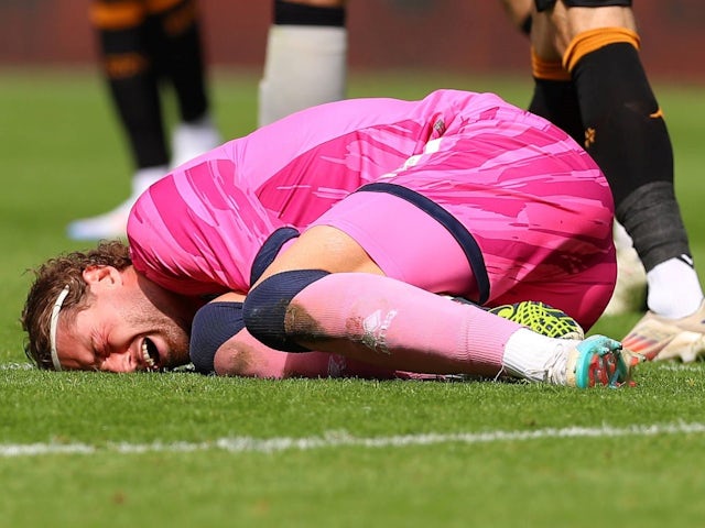 Lukas Jensen of Millwall goes down injured during the Hull City AFC v Millwall FC sky bet EFL Championship match at the MKM Stadium, Hull, England, United Kingdom, on 24 August 2024 [on August 25, 2024]