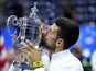 Novak Djokovic kisses the trophy after winning the US Open on September 11, 2023