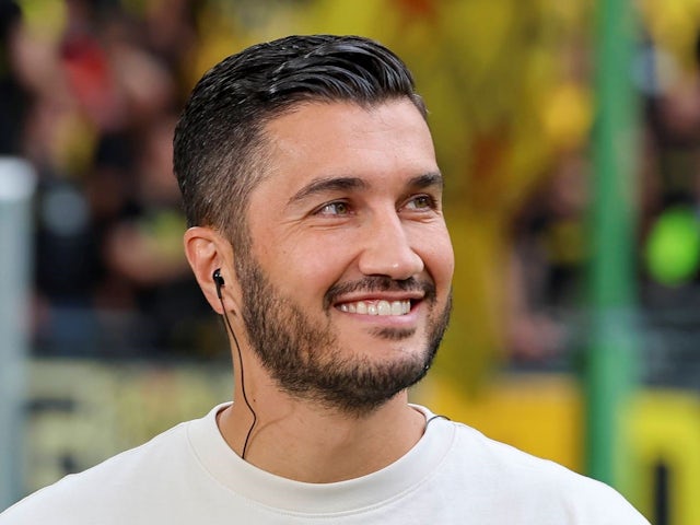 Coach Nuri Sahin of Borussia Dortmund smiles during his side's DFB Pokal First Round match against Phoenix Luebeck vs Borussia Dortmund, Volksparkstadion, on August 17, 2024 [on August 22, 2024]