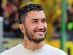 Coach Nuri Sahin of Borussia Dortmund smiles during his side's DFB Pokal First Round match against Phoenix Luebeck vs Borussia Dortmund, Volksparkstadion, on August 17, 2024 [on August 22, 2024]