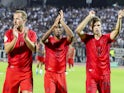 Bayern Munich's Harry Kane, Kingsley Coman and Thomas Muller applaud the fans after the match on August 16, 2024