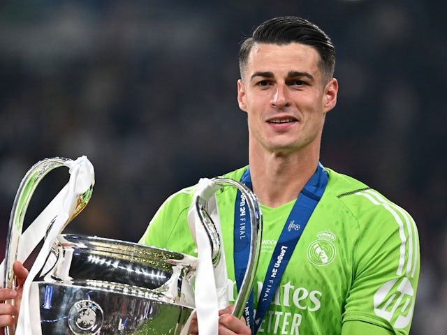 Kepa Arrizabalaga celebrates with the Champions League trophy on June 1, 2024