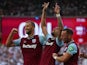 West Ham United's Lucas Paqueta celebrates scoring their first goal with Tomas Soucek and Vladimir Coufal on August 17, 2024