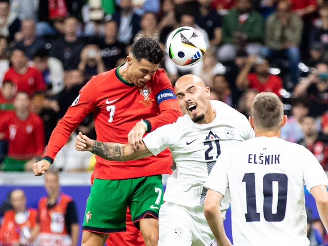 Portugal's Cristiano Ronaldo challenges for a header on July 1, 2024