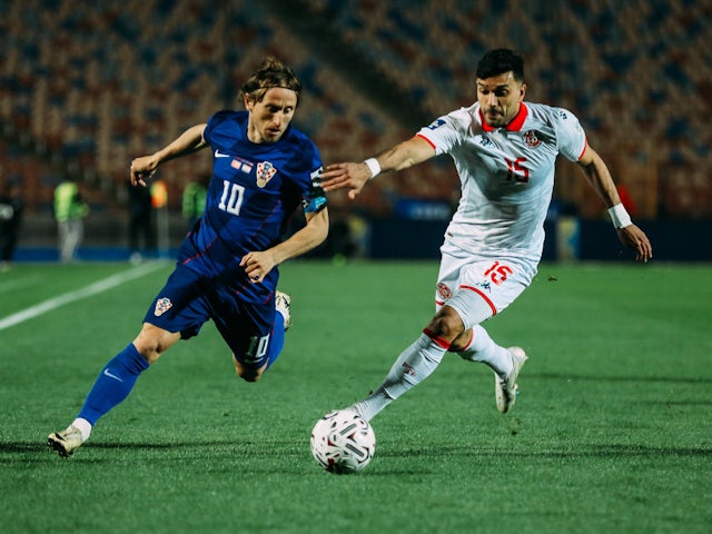 Luka Modric of Croatia is in action with Oussama Haddadi of Tunisia on August 31, 2024