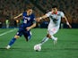 Luka Modric of Croatia is in action with Oussama Haddadi of Tunisia on August 31, 2024